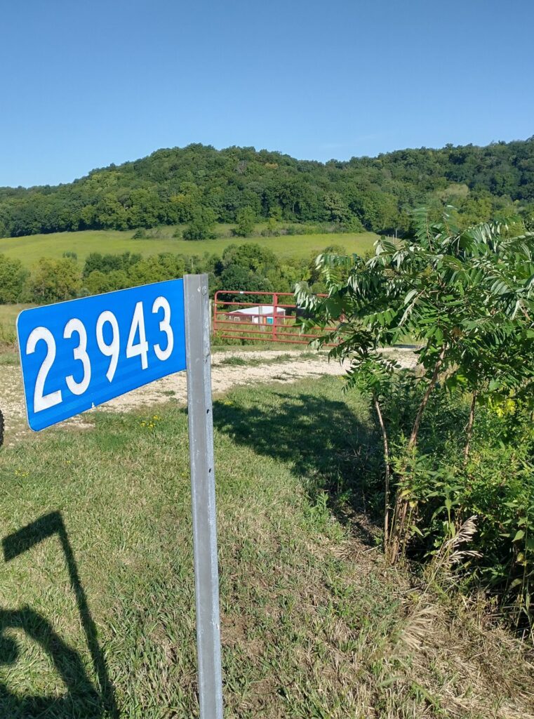 911 sign at rifle range entrance