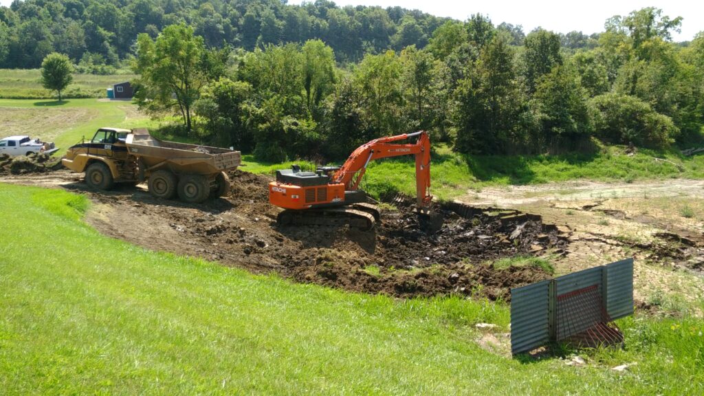 Excavator digging dirt