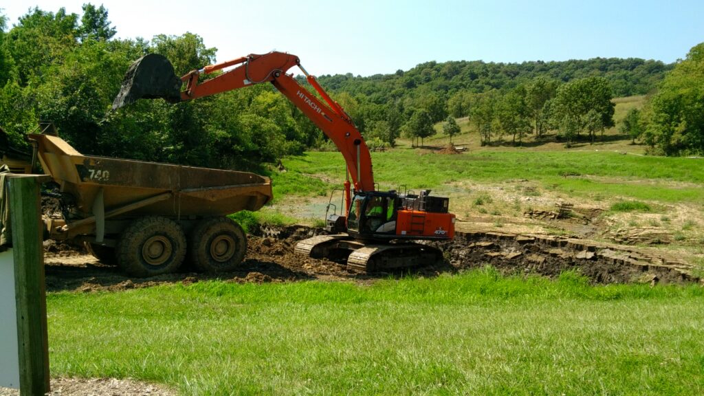 Excavator loading dirt